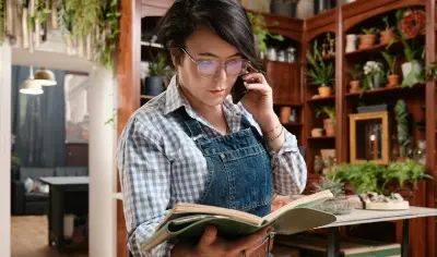 Small business owner reading book