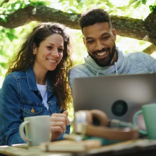 two people looking at laptop